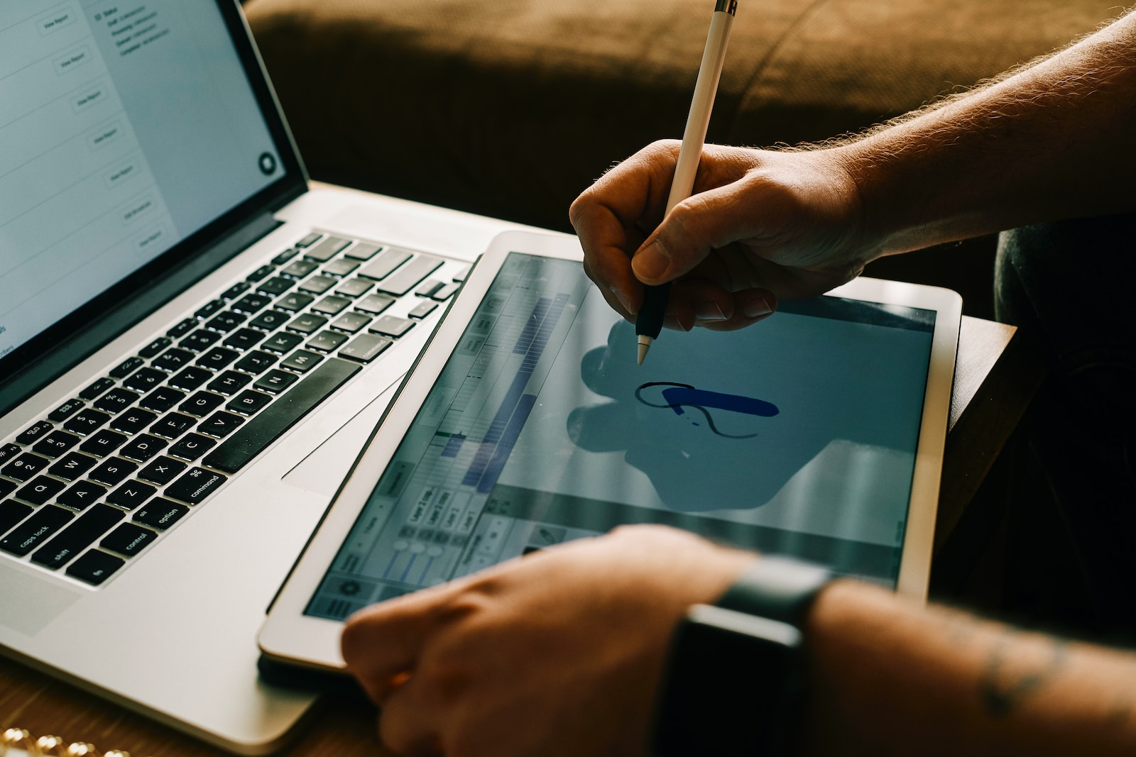 Photo by ConvertKit person writing on white paper